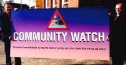 a photograph of the Community Watch sign