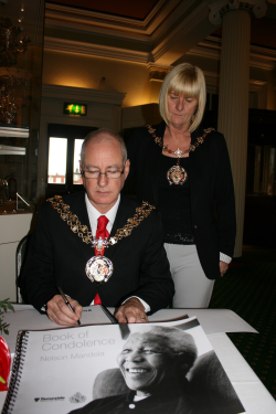Mayor Joe Kitchen signing the book of condolence