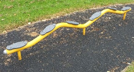 Balance beam situated on wetpour