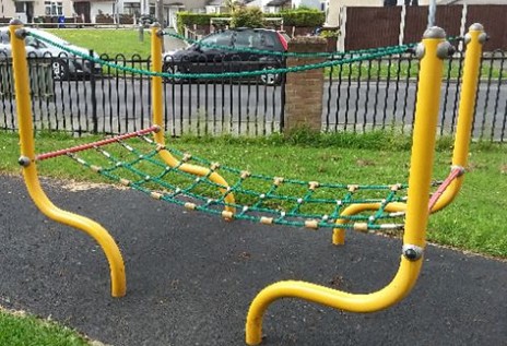 Netted rope bridge situated on wetpour