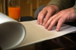 Image of someone reading braille