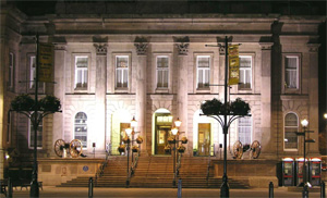 Image of Ashton under Lyne Townhall lit up in the evening