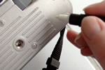 Image of someone marking a camera for security purposes