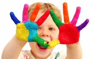 Happy child with painted hands