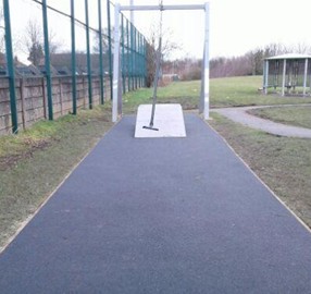 Sloped spinning deck situated on wetpour