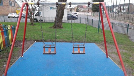 Netted basket swing situated on wetpour