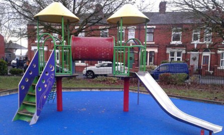 Multi-play unit with step access, netted climbing access, tunnel sliding pole and slide situated on wet pour