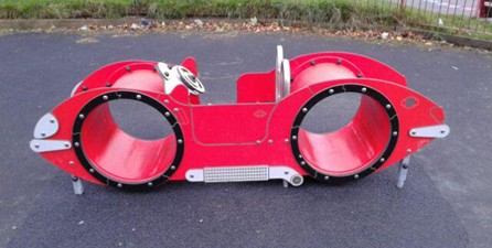 Car unit including tunnels and play seat situated on wetpour