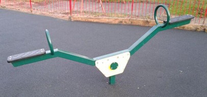 Metal seesaw situated on wetpour