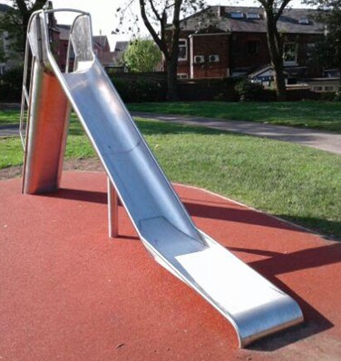 Metal slide with step access situated on wetpour