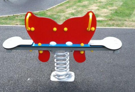 Spring operated seesaw situated on wetpour