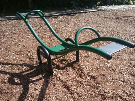 Metal seesaw situated on playbark