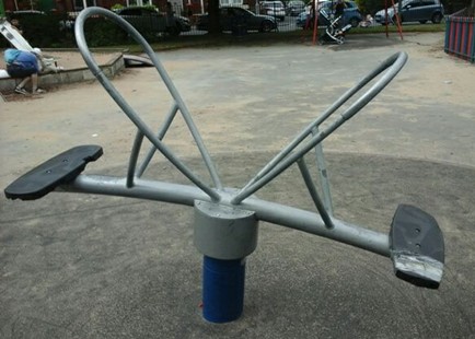 Sweeping seesaw situated on wetpour