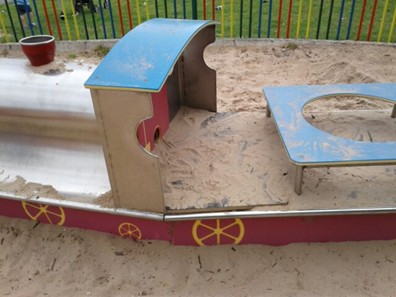 Ladybird spring rocker situated on wetpour