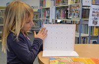 child reading in library