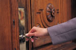 Image of someone locking a door