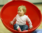 Image of a child sitting in a large toy