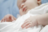a photograph of a baby sleeping