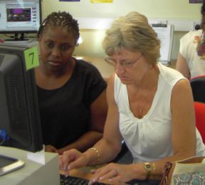 A picture of a customer being taught by a computer buddy
