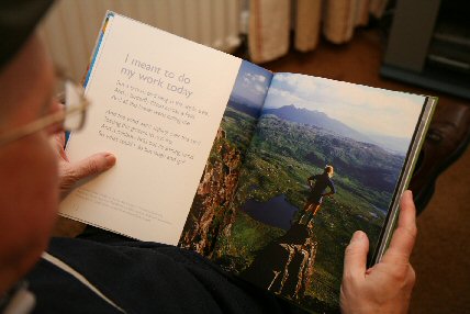 a picture of someone enjoying the book Travelling in pictures