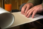 Image of someone reading braille