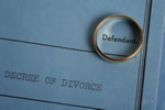 Image of a divorce decree and wedding ring