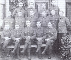 Joe is seated on the middle row second from the left