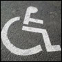 Disabled Persons graphic - image of wheelchair sign painted on road surface